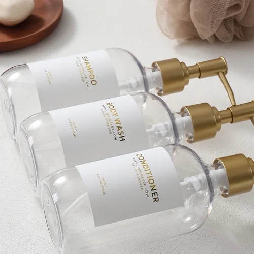 Vista 5 de Botellas dispensadoras de champú y acondicionador con bandeja de bambú Bomba Clear&gold